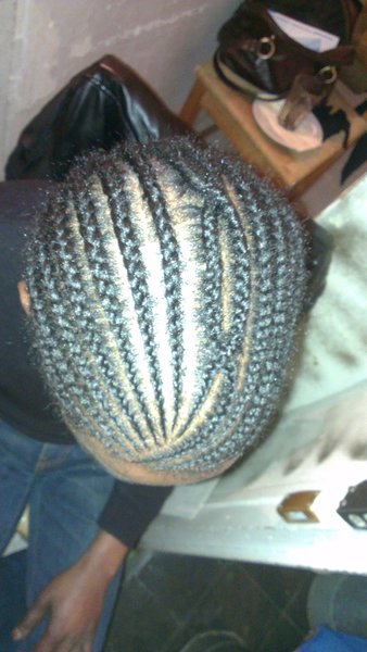Tresses plaquées homme